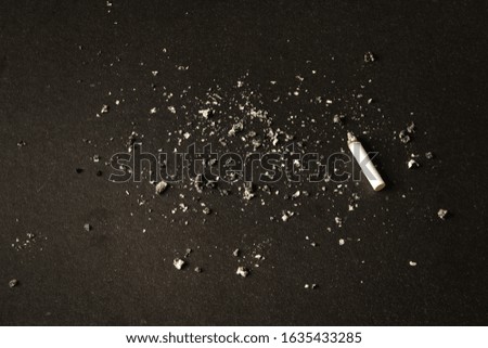 cigarette butt, on a black background