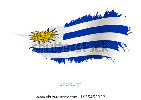 Flag of Uruguay in grunge style with waving effect, vector grunge brush stroke flag.
