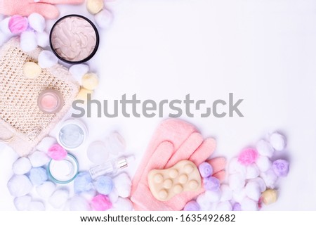 Cosmetic products and face and body care products. On a white background, top view. Copy space