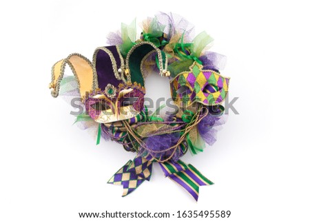 Mardi gras wreath isolated on white background with mardi gras mask. Top view
