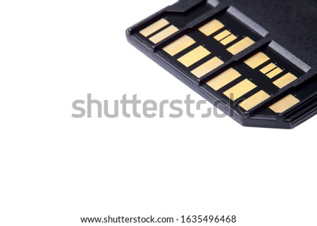 Selective focus photo of two rows of golden contacts on back of UHS-II high speed memory card isolated on white background close up. Fast modern memory storage disk for 4K 6K or 8K video recording