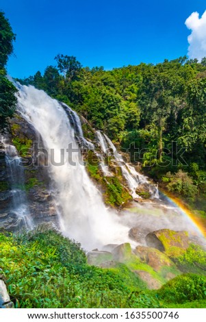 Wachirathan Waterfall at Doi Inthanon National Park, Mae Chaem District, Chiang Mai Province, Thailand. Fresh flowing water in tropical rainforest. Green trees, vibrant colors, tranquility.