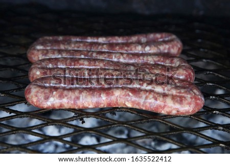 South African boerewors (traditional sausage) being grilled on a braai (Barbeque). 