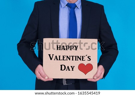 businessman with poster and text valentine