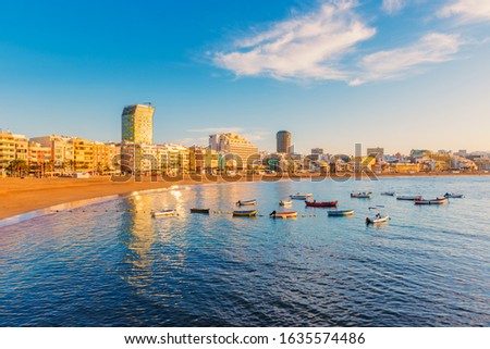City Beach of Las Palmas, capital of Gran Canaria, Canary Islands, Spain, captured around sunset. The beach is called Playa de las Canteras. Royalty-Free Stock Photo #1635574486