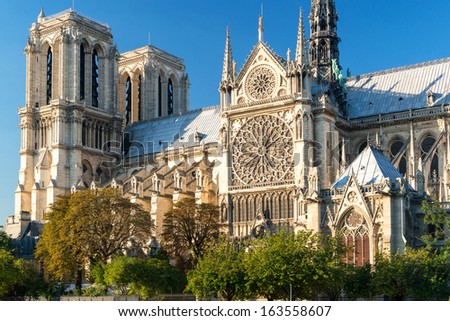 Notre Dame de Paris, France. It is one of top landmarks in Paris. Beautiful view of the majestic medieval cathedral in Paris center in summer. Famous nice Gothic architecture of Paris in sunlight.
