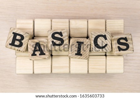 BASICS word made with building blocks on beige background