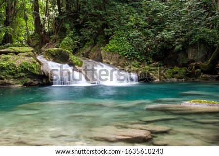 adventure river trekking in Jamaica down stream from the Reach Falls, long exposure picture