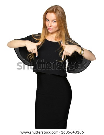 the blonde woman points her fingers down. girl in dark clothing on a white isolated background