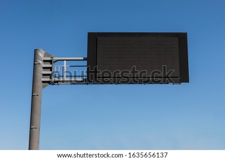 Digital Empty Road Signboard in the blue sky background.