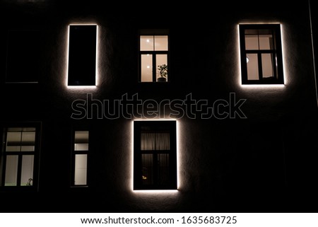 Windows at night. House building lights seamless background. Seamless illustration resembling illuminated windows in a tall building at night.