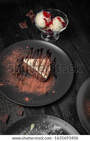 Set of desserts. Pieces of juicy delicious cakes. Festive table with delicious food on black boards.