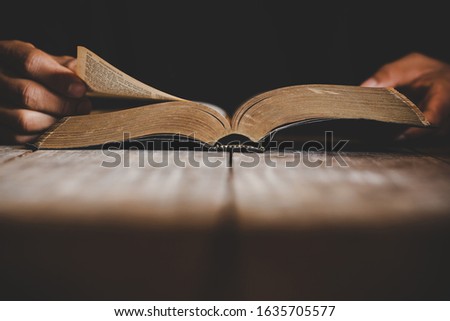 Sunday readings bible, a christian man reading the bible.