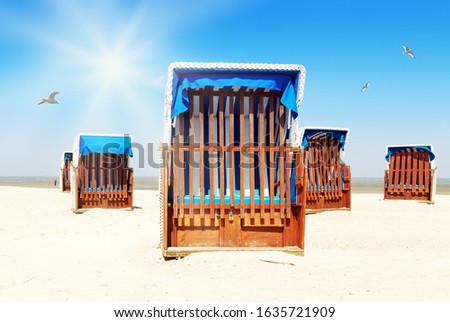Sandy beach with beach chairs on the beach in Cuxhaven in Germany
