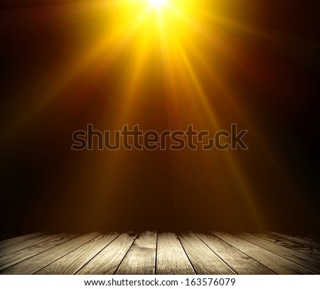 Light on wooden floor in empty room 
