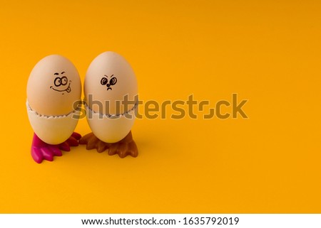 Easter eggs emoticon character on an yellow background with copy space . 