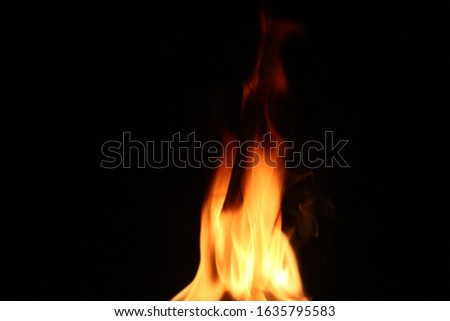 The yellow-red heat energy fire that burns different characteristics at night, isolated on a black background.