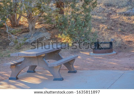 Campsite with a fire pit and picnic table at Fool Hollow Lake in Show Low, Navajo County, Apache Sitgreaves National Forest, Arizona USA