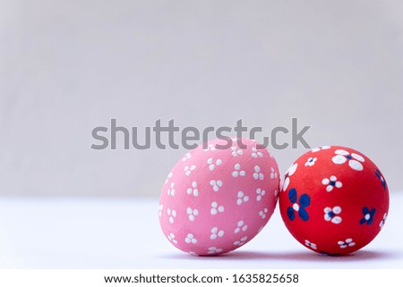 Colorful handmade easter eggs isolated on a white background, with space for your text.