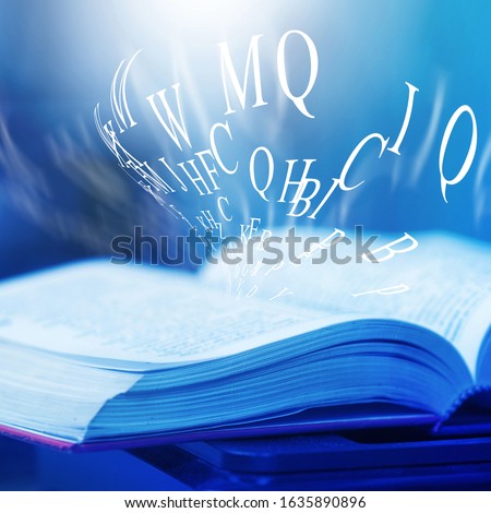 The books magic light with the bright shining down  background. Imagine a picture book concept background. knowledge concept learning technology. education kids books isolated.book opened on a wooden 