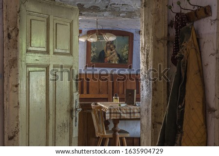 view into a room with table lamp and picture in a farmhouse