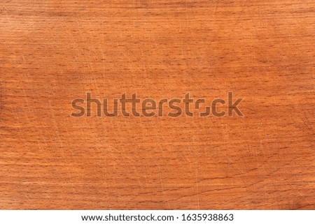 Brown scratched wooden cutting board. Wood texture.Kitchen concept.