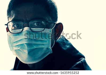 Image of the man wearing a medical mask, Prevention of contagious  covid-19, Respiratory protection coronavirus concept, on a white background Royalty-Free Stock Photo #1635955252