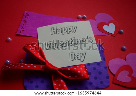 Happy Valentine's Day card with sign and peper hearts close up