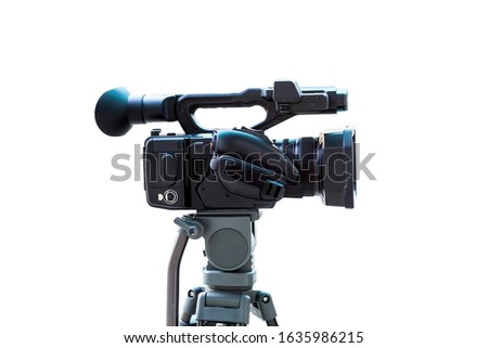 Camera for filming movies with a tripod on a white background with cliipping path. Side view of the video camera isolate on white background.