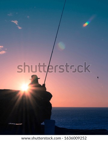 Silhouette of a fisherman Sydney Australia at sunrise