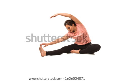 Indian Woman / Girl performing Yoga asana or meditation or dhyan, sitting isolated over white background Royalty-Free Stock Photo #1636034071