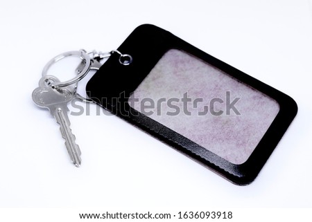 key and  keychain with case of card or tag
