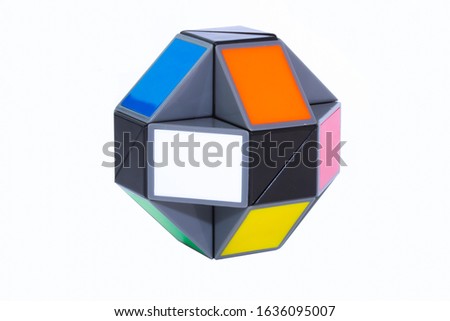 Toy colorful snake puzzle in shape of ball on white background