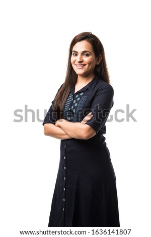 Portrait of Pretty Indian girl / woman or lady wearing traditional salwar kameez or punjabi dress, standing isolated against white background Royalty-Free Stock Photo #1636141807