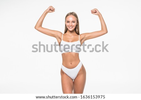 sport fitness woman flexing show her biceps muscles, young smile girl athletic body, perfect figure wear panties isolated over white background