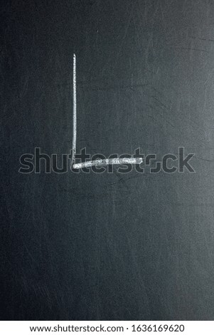 Letter L on a chalk board Royalty-Free Stock Photo #1636169620