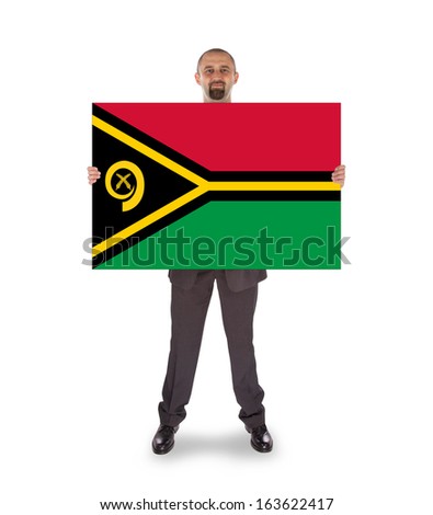 Smiling businessman holding a big card, flag of Vanuatu