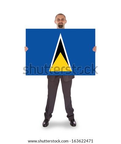 Smiling businessman holding a big card, flag of Saint Lucia