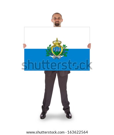 Smiling businessman holding a big card, flag of San Marino