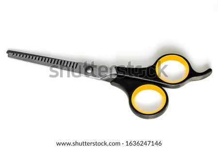 Hairdressing scissors on a white background
