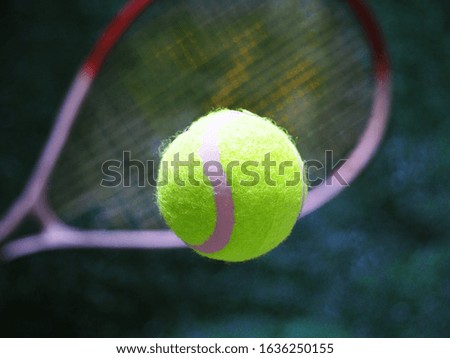 An extreme closeup slow motion action capture of a tennis ball Take pictures while moving