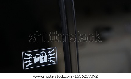 Close up of the automatic door emblem on the car