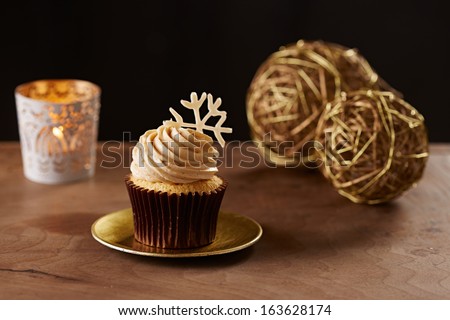 Snowflake cupcake on black Christmas background