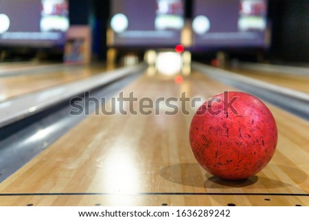 red bowling ball and blur background in bowling playground