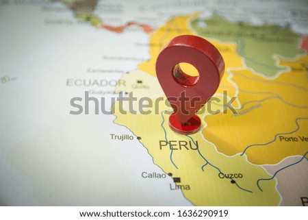 Peru in focus on world map with a location GPS icon
