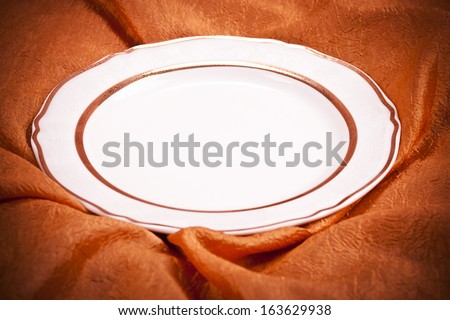 plate on orange background