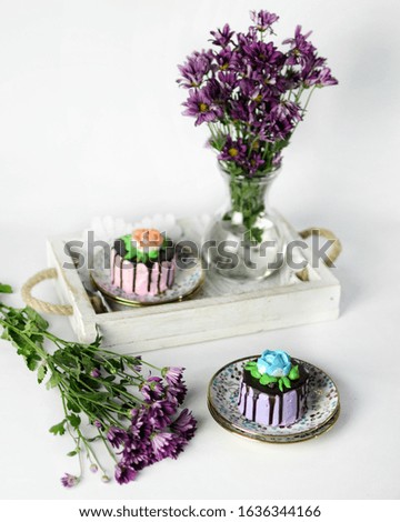 isolated Cake for dessert or tea time on white background with purple flower as decoration