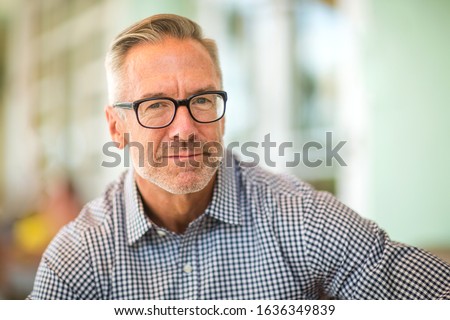 Portrait of a mature handsome man. Royalty-Free Stock Photo #1636349839