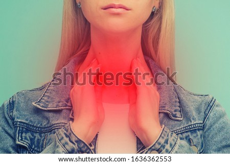 A young girl has a sore throat. Thyroid problems - Image toned