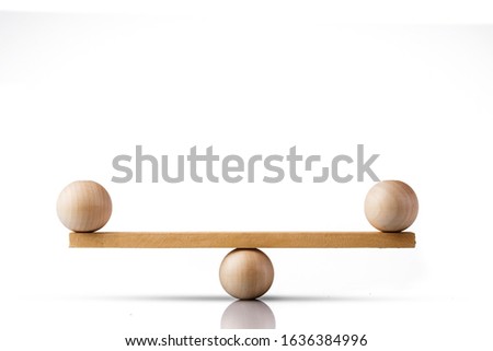 Balance concept, board on wooden top hat like balance isolated on white background,